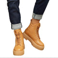 Women's tan combat boots with sturdy outsole for everyday wear