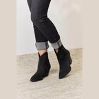 Women's black cowboy boots with sparkly design for stylish footwear