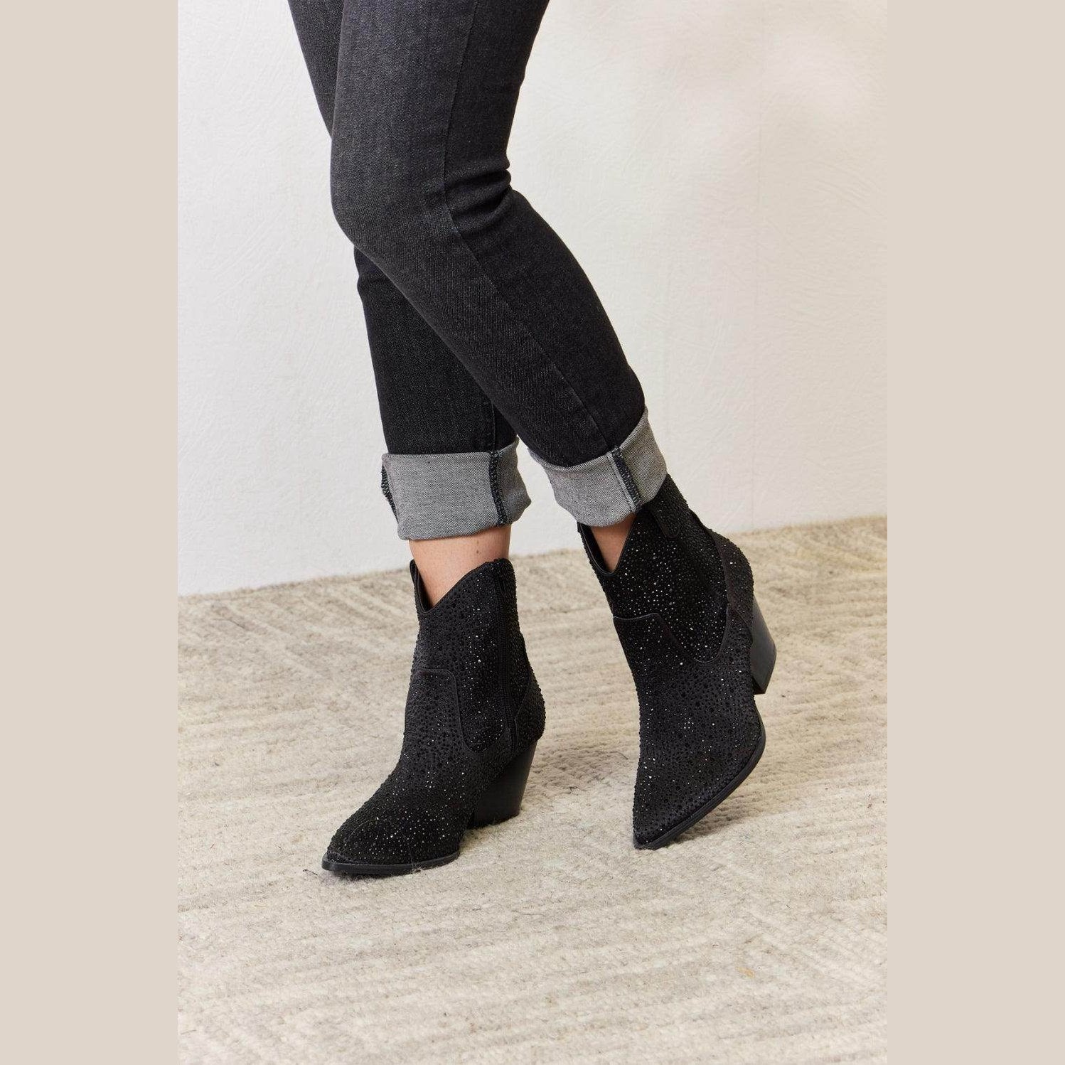 Women's black cowboy boots with sparkly design for stylish footwear