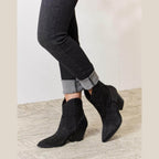 Trendsi women's black cowboy boots with studded detailing for stylish wear