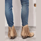 Women's beige cowboy boots with fringe detail, stylish for casual wear