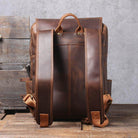 Back view of a crazy horse leather daypack with padded straps and durable stitching, ideal for everyday use