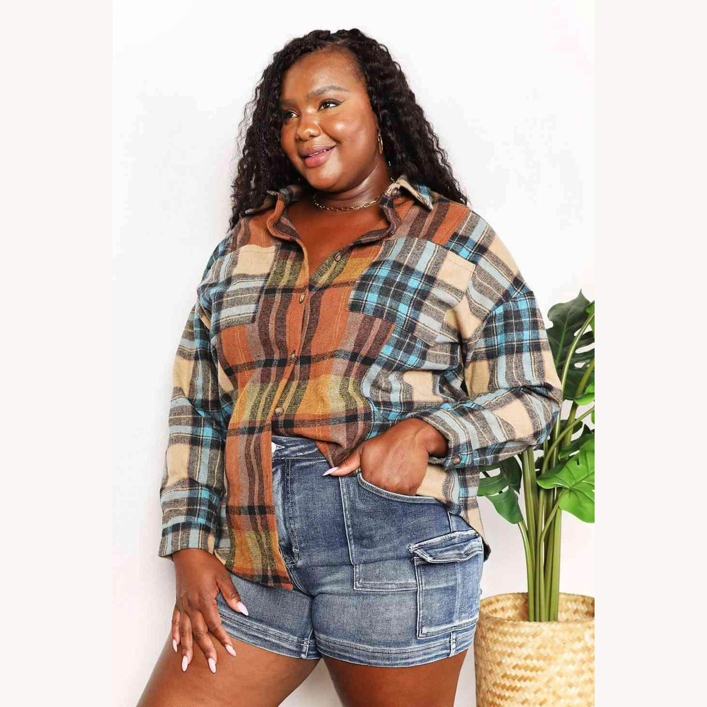 Trendsi women's curved hem plaid shacket in earthy tones, styled with denim shorts for a casual look