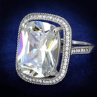 Cushion cut silver cocktail ring with a large center stone surrounded by sparkling accents