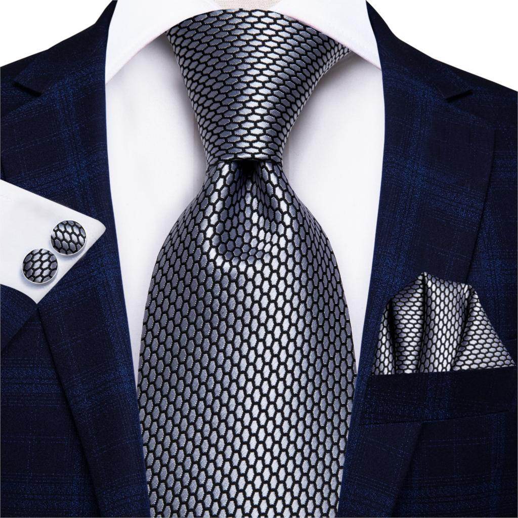 Stylish designer wedding ties for men in gray with a modern pattern and matching pocket square and cufflinks