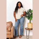 Trendsi Women's Double Take Crochet Top with Pleated Detail, paired with casual denim jeans
