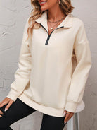 Trendsi women's dropped shoulder pullover top in cream with zip collar and relaxed fit style