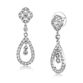 Elegant dangle earrings for vacation outfits featuring a floral design adorned with sparkling crystals