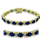 Stunning elegant gold link bracelet for women featuring blue gemstones and sparkling accents