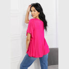 Trendsi elegant pink top with flutter sleeves, styled with casual jeans for a chic look