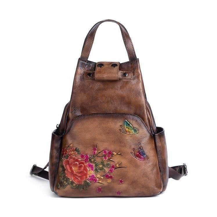 VacationGrabs embossed leather travel bag with floral and butterfly designs for stylish adventures