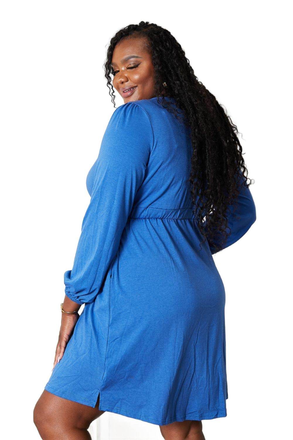 Trendy blue empire waist dress for travel featuring long sleeves and a comfortable fit
