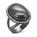 Oval gemstone fashion ring with a dark stone and sparkling accents, perfect for elegant outings