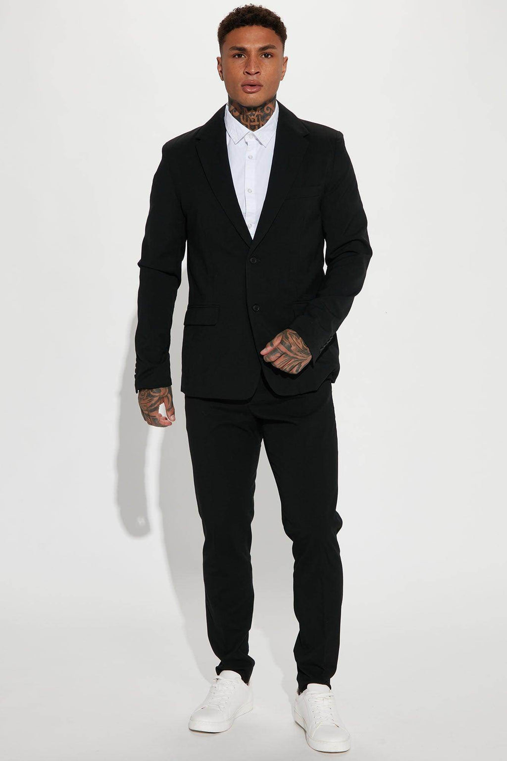 Fashion Nova modern stretch trousers in black paired with a stylish blazer and white shirt