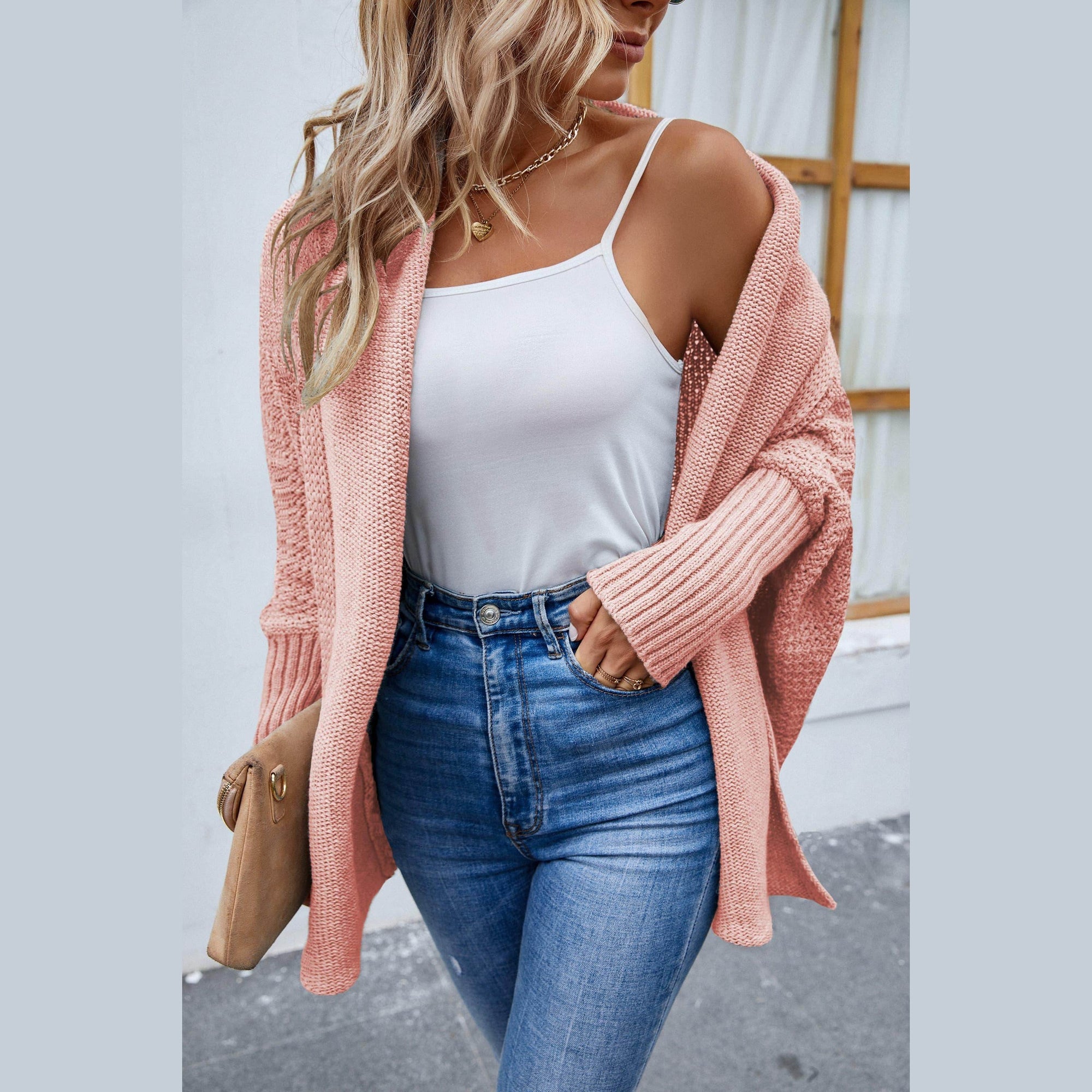 Trendsi stylish travel cardigan in soft pink, paired with a white tank top and high-rise jeans
