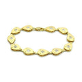 Gold bracelet with teardrop design and gemstones, perfect fashion vacation jewelry for women