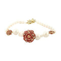 Floral brass bracelet gift featuring red rose design and elegant pearls for women