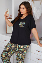 Trendsi women's sleepwear featuring a black top and floral pants set for women with a stylish pocket
