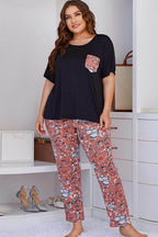Trendsi floral pants set for women featuring a black top with pocket and floral patterned pants