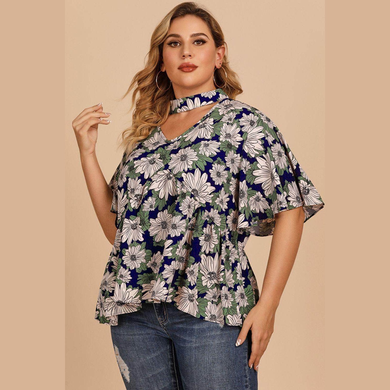 Plus-size women's flutter sleeve floral top with a stylish choker detail and vibrant floral pattern