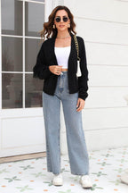 Trendsi women's fringe trim cardigan in black paired with wide-leg jeans for a stylish look