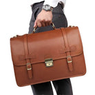 Genuine leather business bag in brown carried by a man in formal attire with a watch