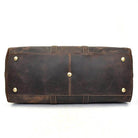 Bottom view of a genuine leather weekender bag with brass studs for durability and style