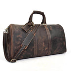 Genuine leather weekender bag with spacious interior and adjustable shoulder strap for travel
