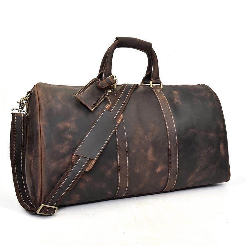 Genuine leather weekender bag with spacious interior and adjustable shoulder strap for travel