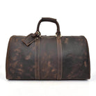Genuine leather weekender bag in dark brown with sturdy handles and a classic design for stylish travel
