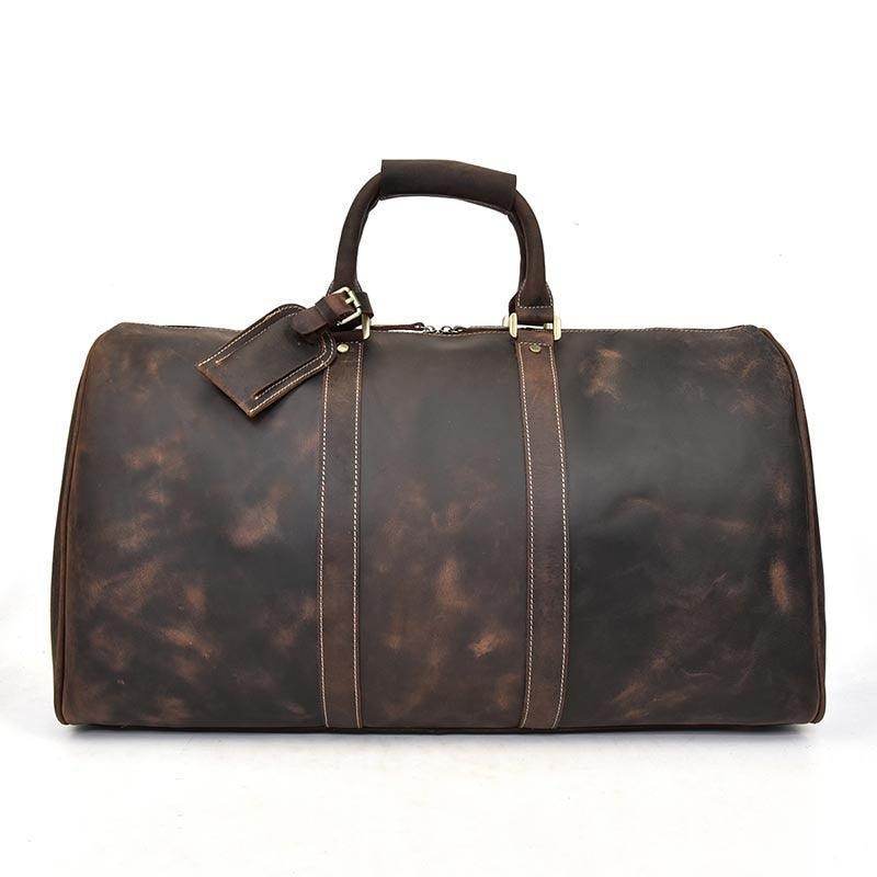 Genuine leather weekender bag in dark brown with sturdy handles and a classic design for stylish travel