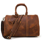 Genuine leather weekender bag in rich brown color with dual handles and adjustable shoulder strap
