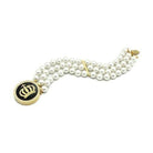 Stylish gold brass bracelet for women with pearl design and crown emblem for fashionable wear
