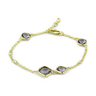 Elegant gold brass bracelet with synthetic glass gemstones, perfect for stylish outfits