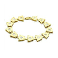 Gold brass geometric bracelet featuring unique triangular links with clear gemstone accents