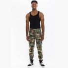 Men's green brown camo sweatpants from VacationGrabs with elastic waistband and cuffed ankles