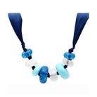 Handmade blue beaded necklace with large beads in various shades of blue and white