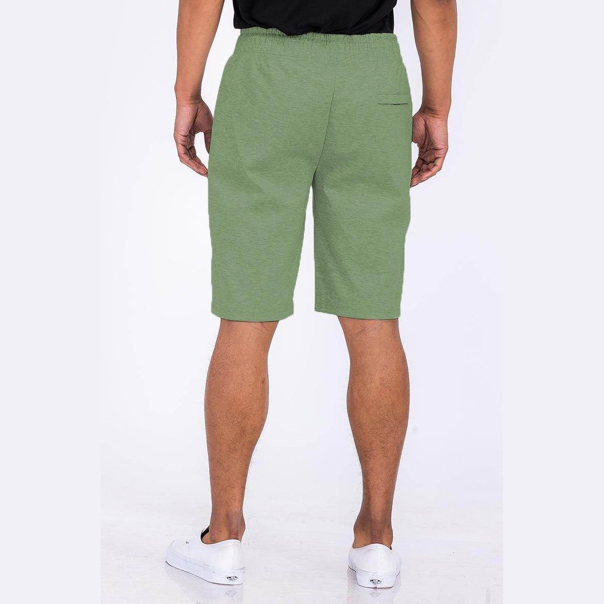 Back view of heathered mens shorts in green from VacationGrabs featuring an elastic waistband and pocket