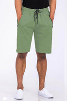 Heathered mens shorts in green color with an elastic waist and side pockets for casual wear