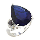 Elegant high polished sterling silver ring featuring a large pear-shaped blue gemstone and sparkling accents