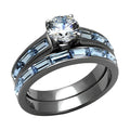 IP gun color engagement ring featuring a sparkling center stone and blue accent gems