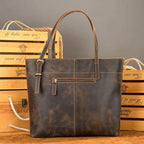 Brown leather messenger bag for travel with adjustable straps and multiple pockets for organization