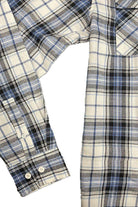 Light blue flannel shirt from VacationGrabs with classic plaid pattern and buttoned cuffs