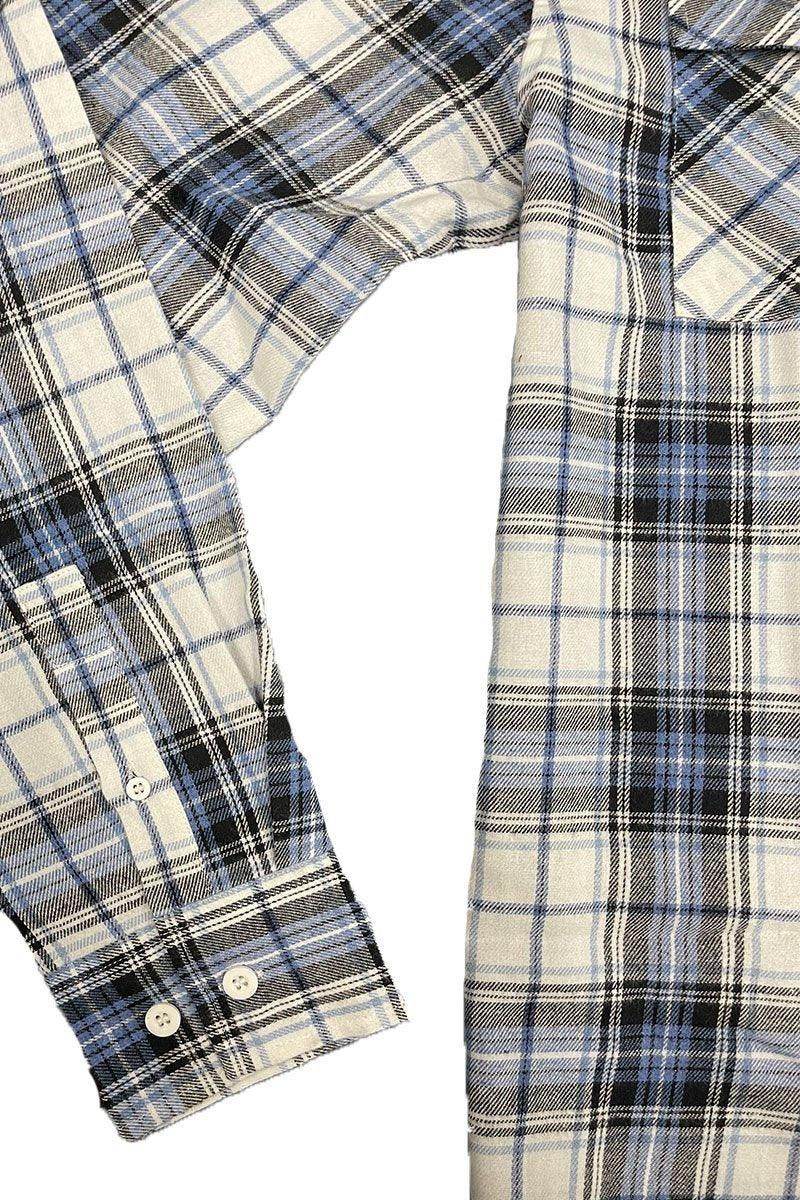 Light blue flannel shirt from VacationGrabs with classic plaid pattern and buttoned cuffs