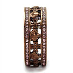 Elegant light rose gemstone ring with intricate cross design and sparkling accents for women's jewelry