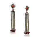 Long copper dangle earrings for women featuring intricate designs and vibrant red accents