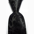 Luxury black silk tie with an intricate pattern for formal and elegant occasions