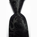 Luxury black silk tie with an intricate pattern for formal and elegant occasions