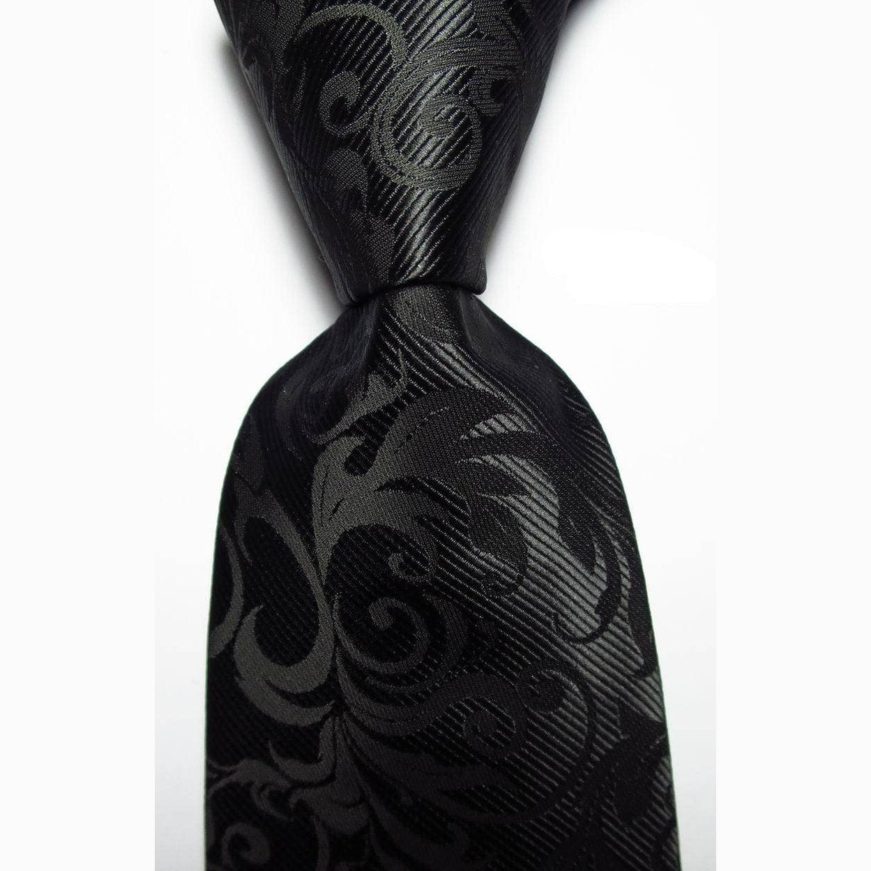 Luxury black silk tie with an intricate pattern for formal and elegant occasions