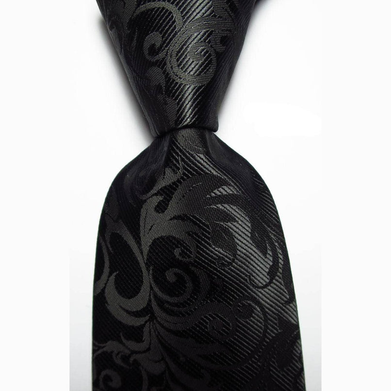 Luxury black silk tie with an intricate pattern for formal and elegant occasions